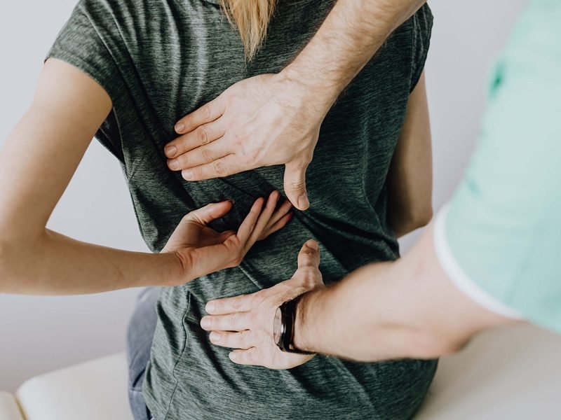 Orthopedic surgeon reviewing an X-ray